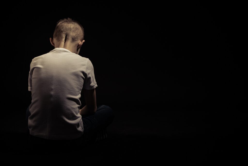 Rear-View-Of-A-Seated-Sad-Youn